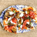 Pinsa met burrata, pittige salami en aubergine